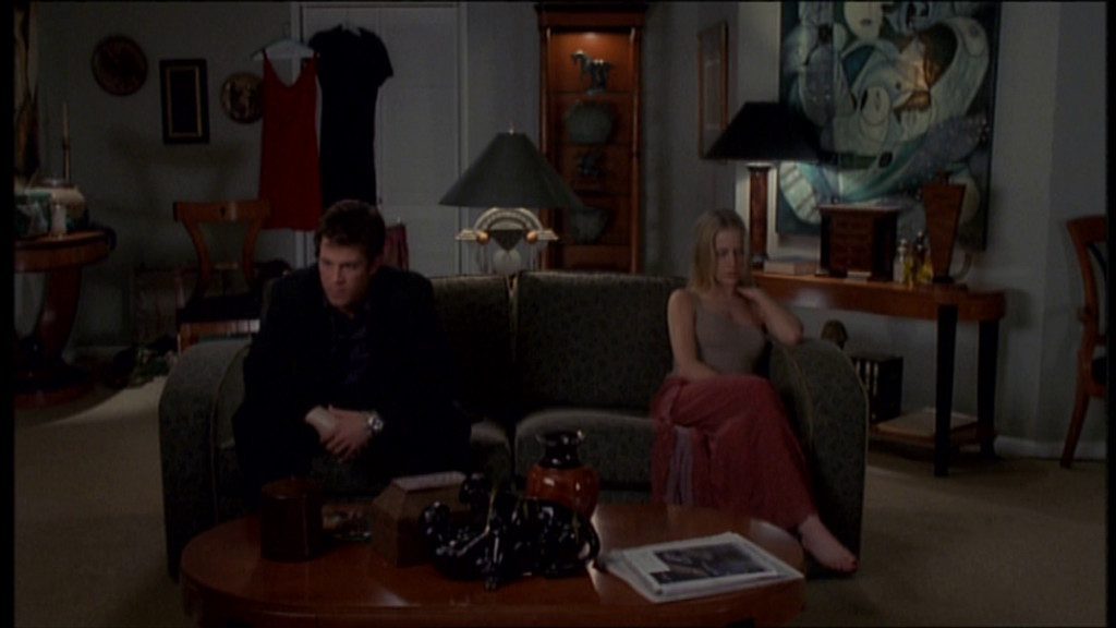 Darla (Julie Benz) tells Lindsey (Christian Kane) that she's slept with Angel.