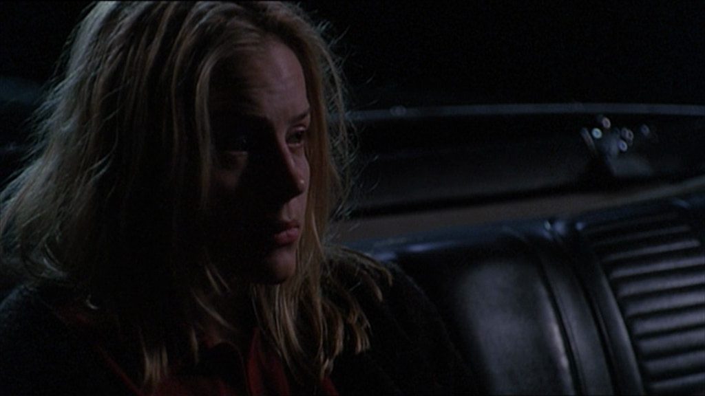 Darla (Julie Benz) sits in the back seat wondering why no one will join her.