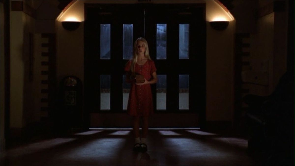 A young girl standing in the college at night in Buffy's dream