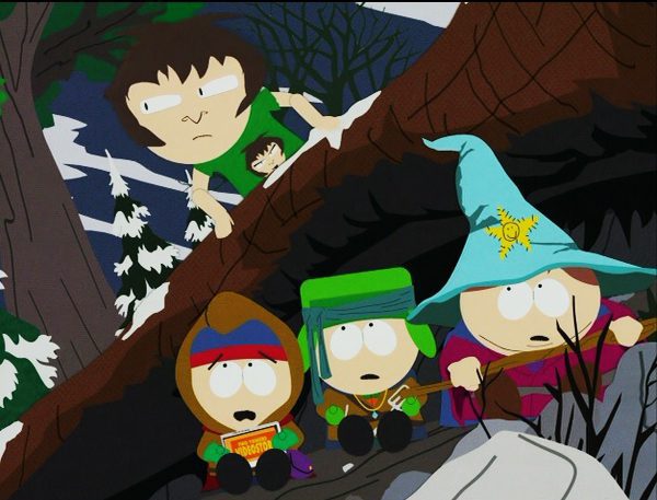 The boys, dressed in their LotR costumes, hide under an overhanging tree while a 6th grader searches for them, in a parody of a similar shot from Fellowship of the Ring