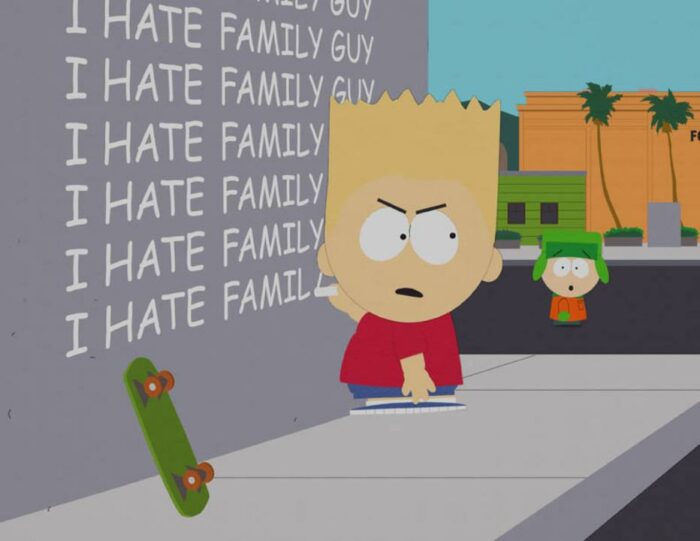 Bart Simpson writes "I hate Family Guy" over and over in chalk on a wall outside, as Kyle approaches