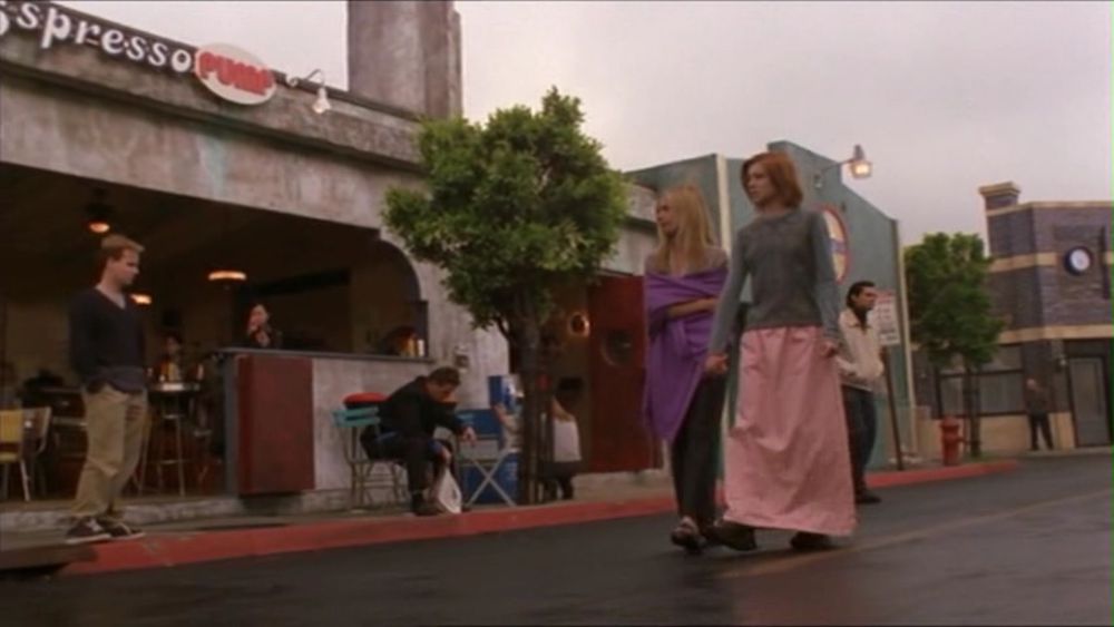 Buffy and Willow holding hands as they walk through the silent streets of Sunnydale