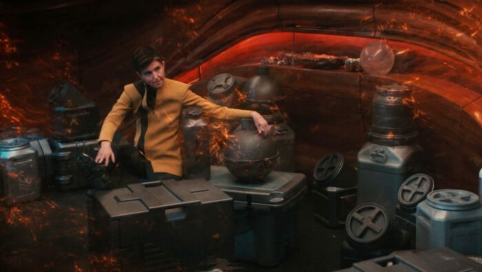 Jett Reno as a hostage on Book's ship, surrounded by cargo boxes