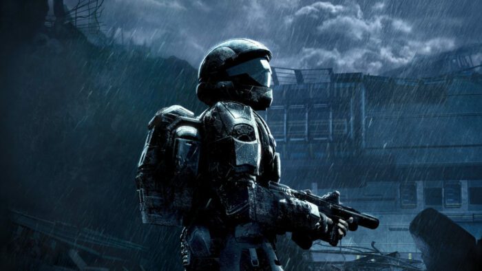 An ODST stands alone in the rain in the wreckage of a city as clouds gather over a dark sky.