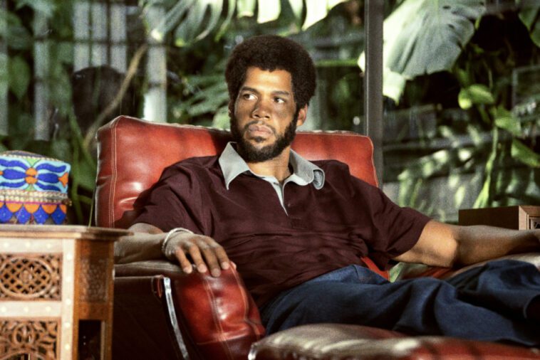 Kareem Abdul-Jabbar sits in a chair in his room.