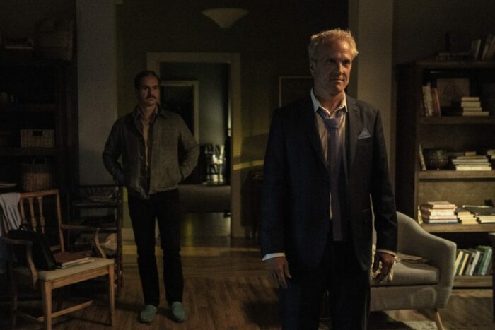 Lalo stands behind Howard in Jimmy and Kim's apartment in Better Call Saul S6E7