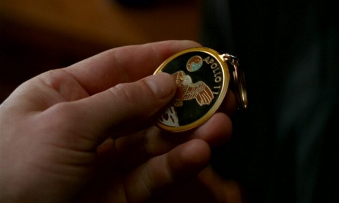 Agent Doggett holds the very same medallion that Mulder once gifted to Scully