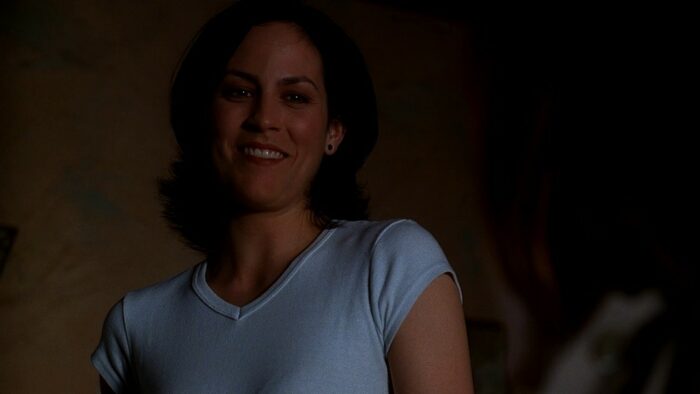 Agent Reyes smiles warmly at Agent Scully