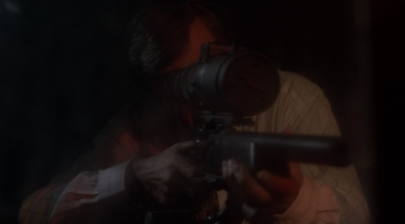 Cigarette Smoking Man behind a sniper rifle in the X-Files