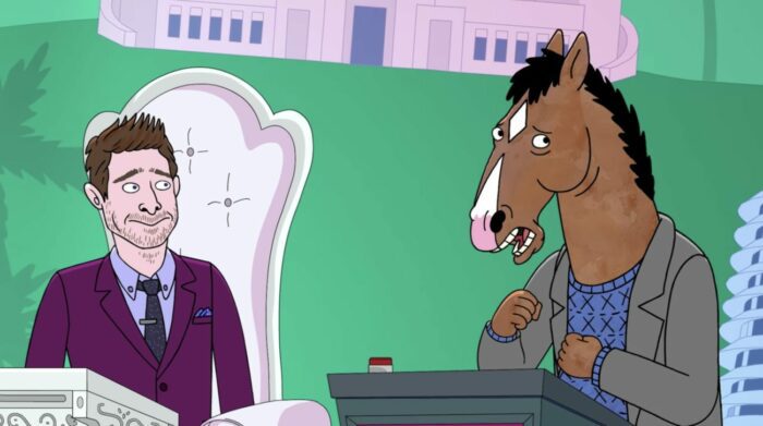 Daniel Radcliffe and BoJack Horseman stand against a green background on a reality show.