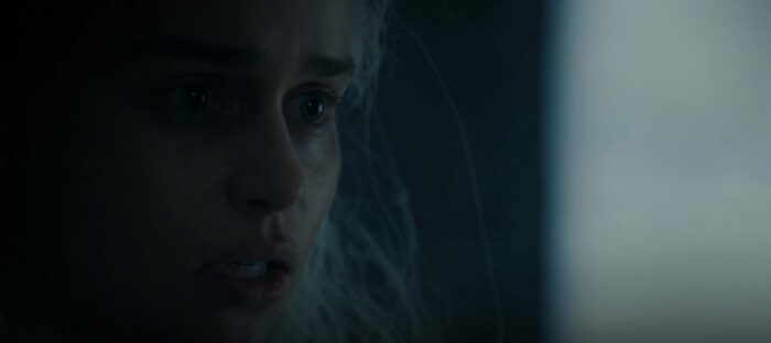 Dany with her face half in the dark, looking desparate