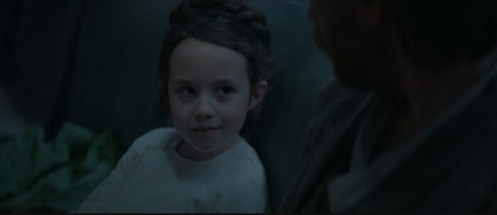 Young Leia gives a smirk
