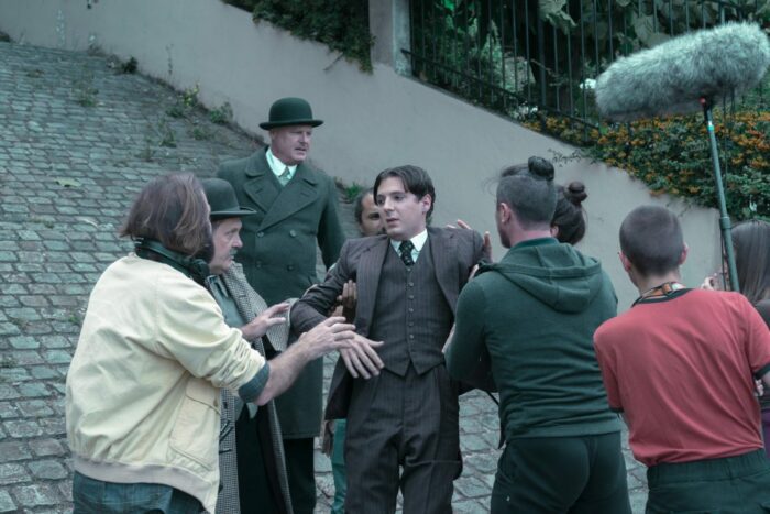 Edmond (Vincent Lacoste) is attended to by the crew of Irma Vep.
