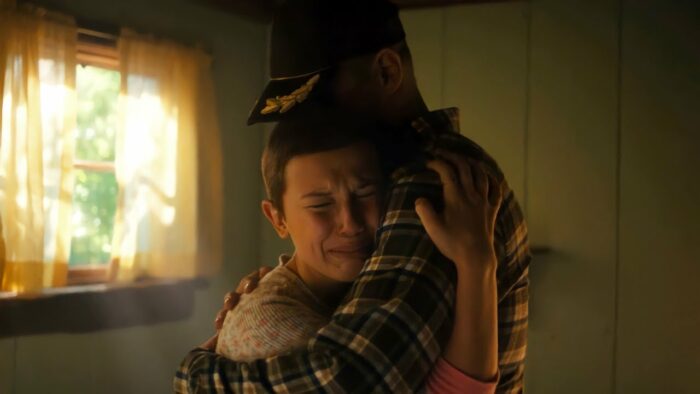 Eleven and Hopper in the cabin hugging
