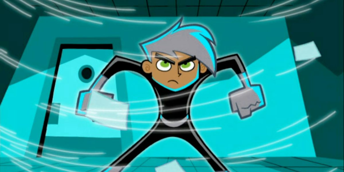 Danny standing in front of a teal wall with his arms at his sides prepared for battle in Danny Phantom