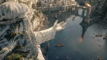An overhead shot of a ship entering Numenor with a giant statue holding out an arm to the left