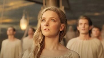 Galadriel and the other elves standing on wooden ship looking up at the sky