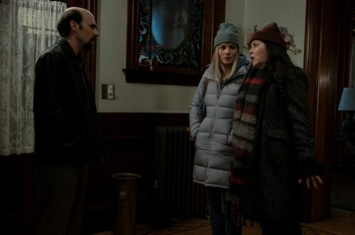 Allison and Patty stand in the entryway of the mortuary, talking to Billy in Kevin Can F**k Himself S2E3