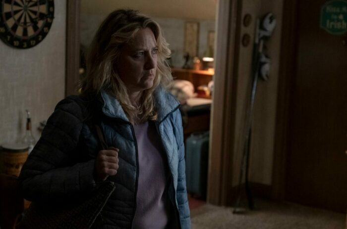 Diane stands near a doorway in a jacket in Kevin Can F**k Himself S2E6