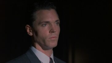 Krycek holds his nerve while addressing The Smoking Man (off-screen)