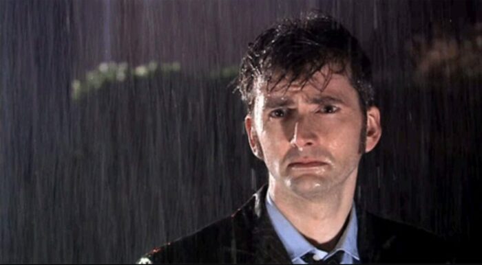 The Doctor looking sad in the rain