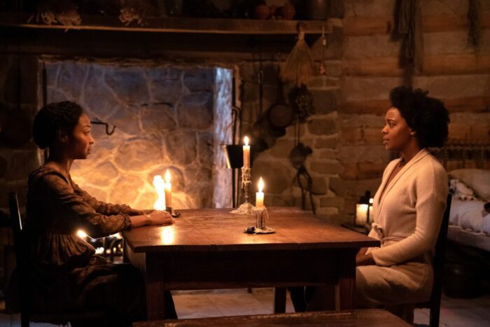 Sheria Irving as Olivia, Mallori Johnson as Dana sitting in Olivia's cottage on Dana's thirdtrip