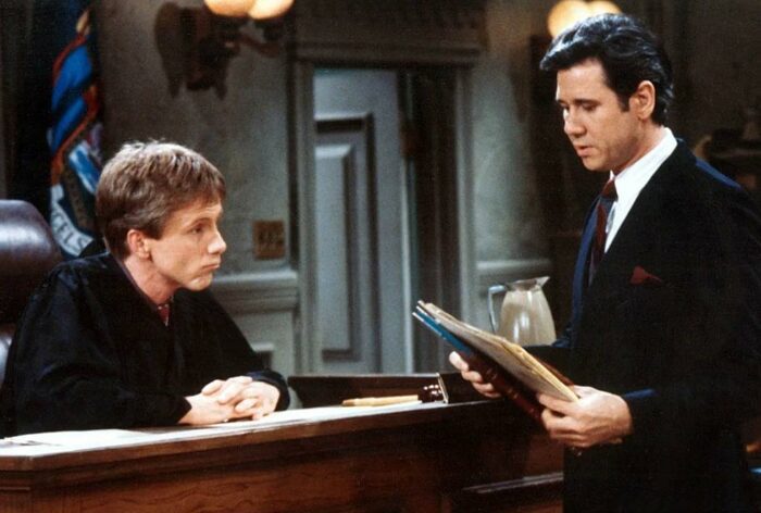 Judge Harry Anderson looks over his bench at Dan Fielding in the original Night Court