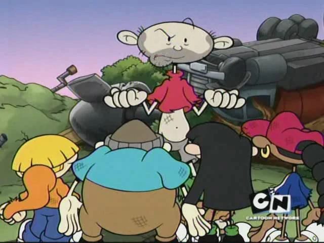 Numbuh One, having been suddenly aged up, still wearing his too-small childwear and having grown a surplus of stubble, looking at the rest of Sector V with a puzzled expression. The group stands in front of their destroyed treehouse base.