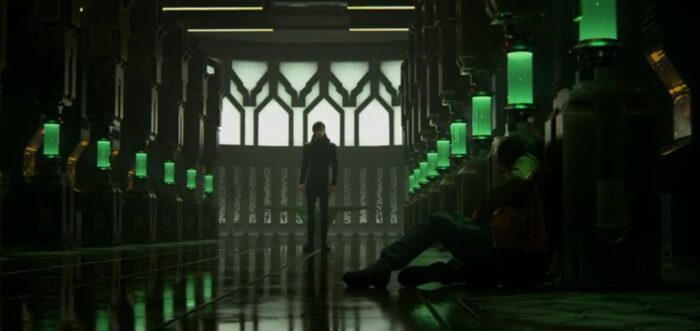 Blade Runner Black Lotus S1E13 - Wallace stands at the end of the replicant manufacturing chamber, Joseph lays on the floor leaning against one of the embryo tanks