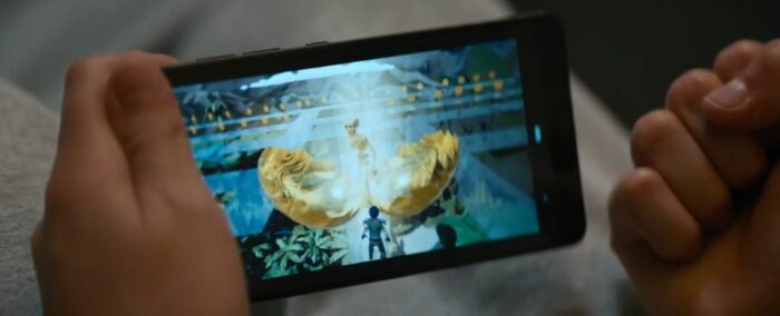 A golden egg has cracked open to reveal a golden skeleton in a video game on a phone screen in The Consultant Season 1 finale