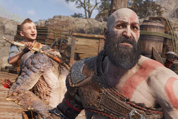 A screenshot of Kratos and Atreus from God of War (2018). Atreus is holding some kind of giant chicken; Kratos is upset.