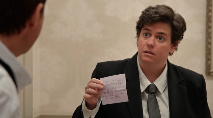 Lt. Toddler (Rebecca Drysdale) presents Michael Bluth (Jason Bateman) with a note he'd left on Lucille 2's door.