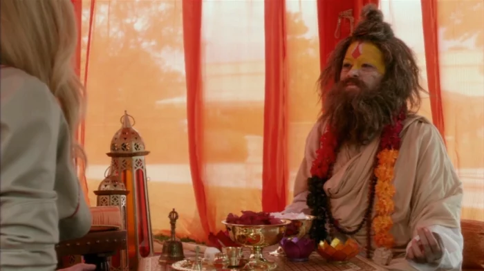 Still of Maeby Fünke (Alia Shawkat) disguised as an Indian shaman, seeing her unwitting mother Lindsay Bluth (Portia de Rossi) as a client.