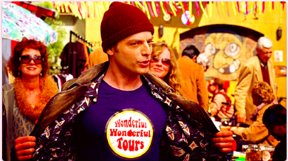 Andy in the middle of a crowded square in Copenhagen, wearing a t-shirt that says "Wonderful Wonderful Tours"