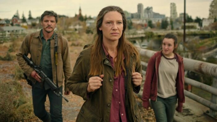 Tess (Anna Torv) leading Joel (Pedro Pascal) and Ellie (Bella Ramsey) in an early episode of The Last of Us.