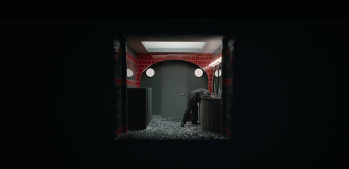 A shot of Jack's head in a bathroom sink, panned out with increased black around the margins in Hello Tomorrow! S1E6