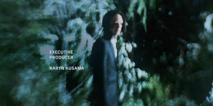 The Man With No Eyes in a suit in the woods