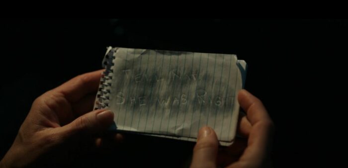 A small notepad with pencil around an outline that reads "Tell Nat She Was Right" in Yellowjackets Season 1 Episode 3