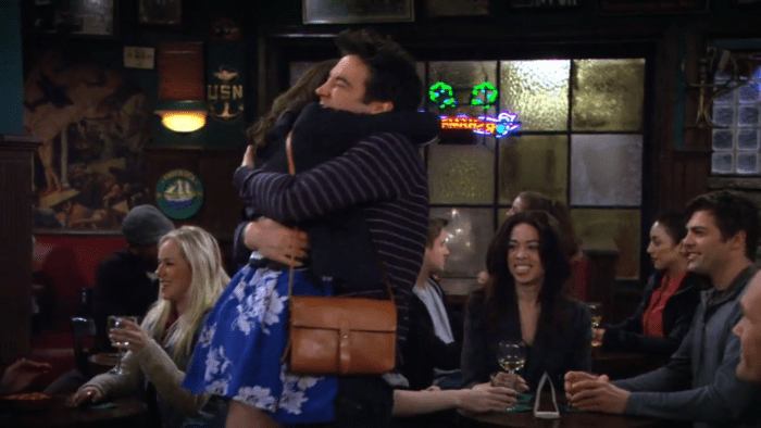 Ted and Tracy embracing in the bar after the news that Tracy is pregnant
