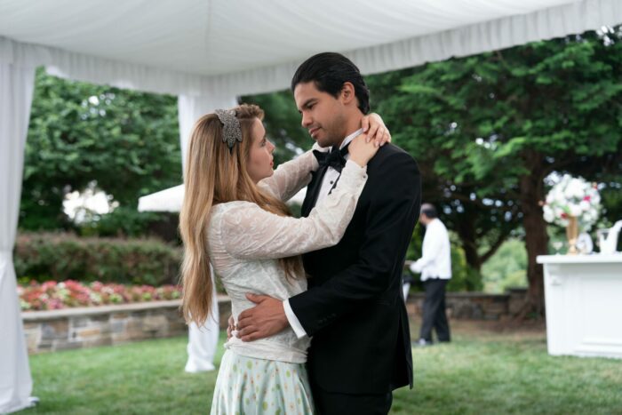 Lindsay and Miguel dance under an awning