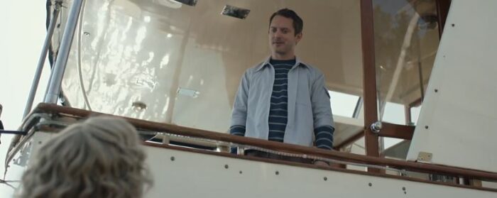 Walter looks down at Misty from aboard a boat