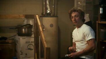 A man sits in a boiler room in a white t-shirt in the trailer for The Bear Season 2, which premieres in summer 2023