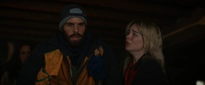 Nat (Sophie Thatcher) looks over at Ben (Steven Krueger), anguished, in Yellowjackets S2E6