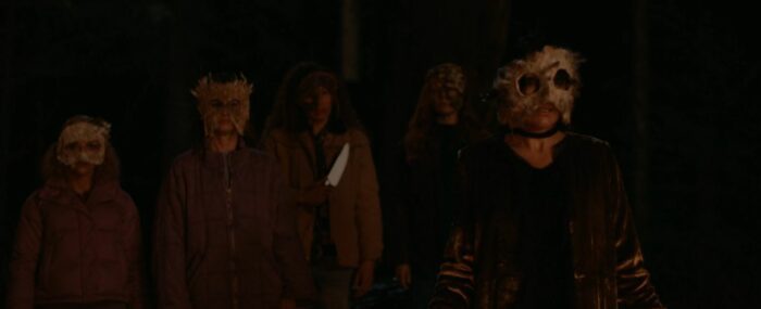 Misty, Tai, Van, and Lottie, wearing masks and holding knives in the Yellowjackets Season 2 finale