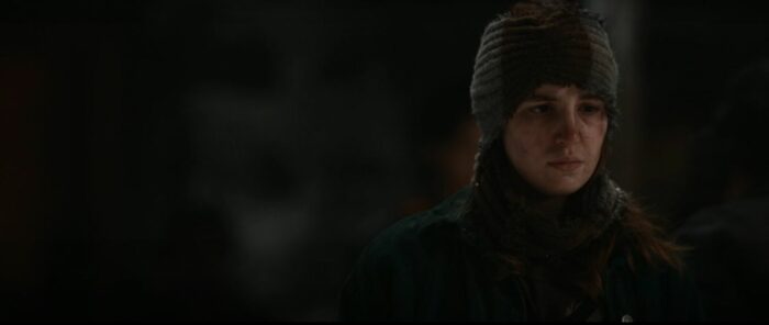Shauna (Sophie Nelisse) looks on with a pained face