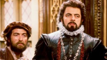Blackadder and Baldrick look mildly alarmed in Queen Elizabeth's court in Blackadder II