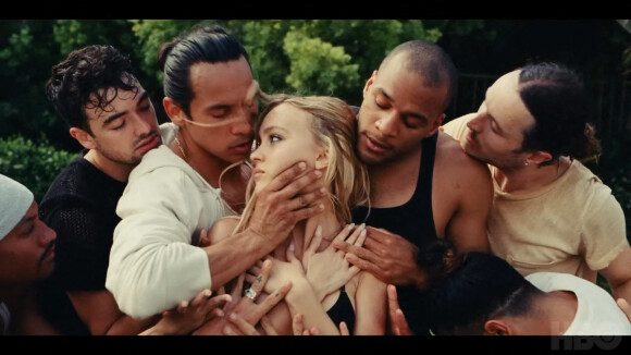 Depp is surrounded by male dancers choking her symbolically in The Idol.