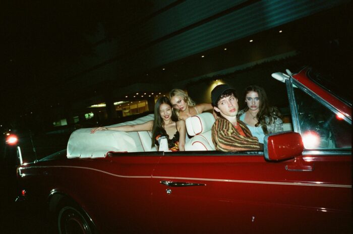 The characters in The Idol drive to a nightclub in a convertible.