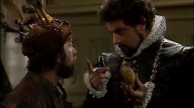Blackadder threatens Baldrick over a potato in Blackadder II