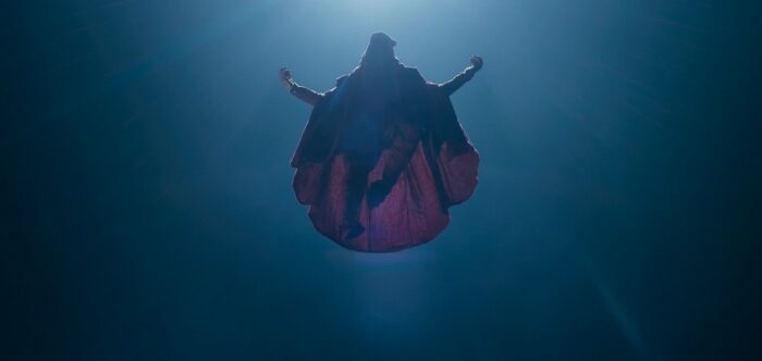 Foundation S2E2 - High Priest Verisof descends from above in full robe and backlit from above